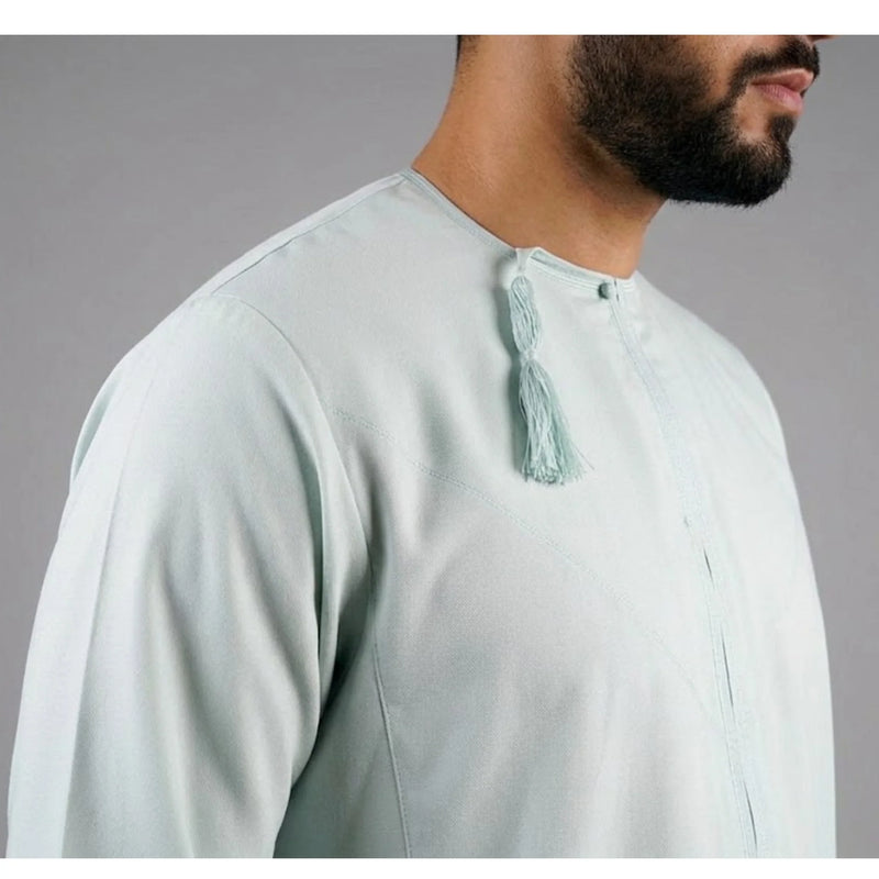 Mans front chest area wearing Omani Thobe in Pistachio green