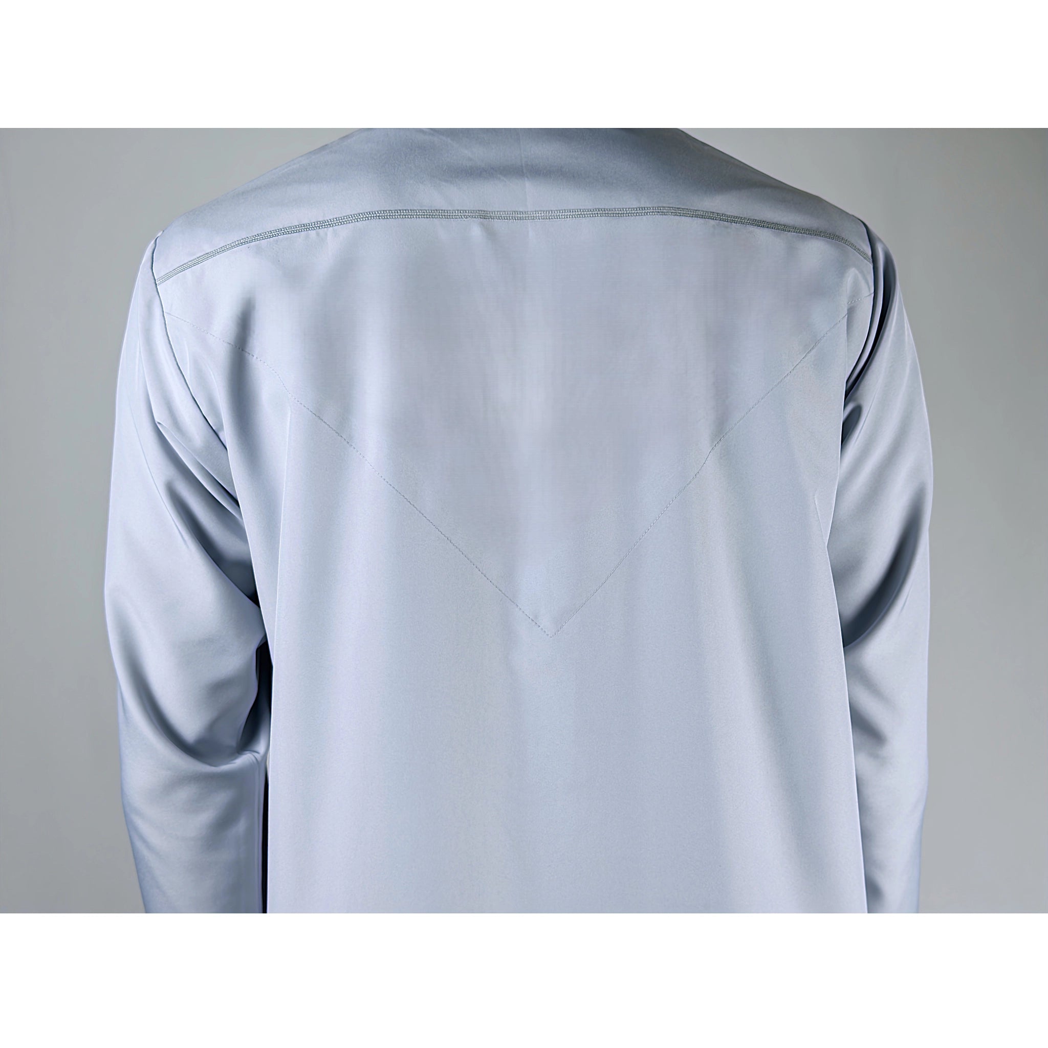 Light fog blue Omani Thobe on a grey background