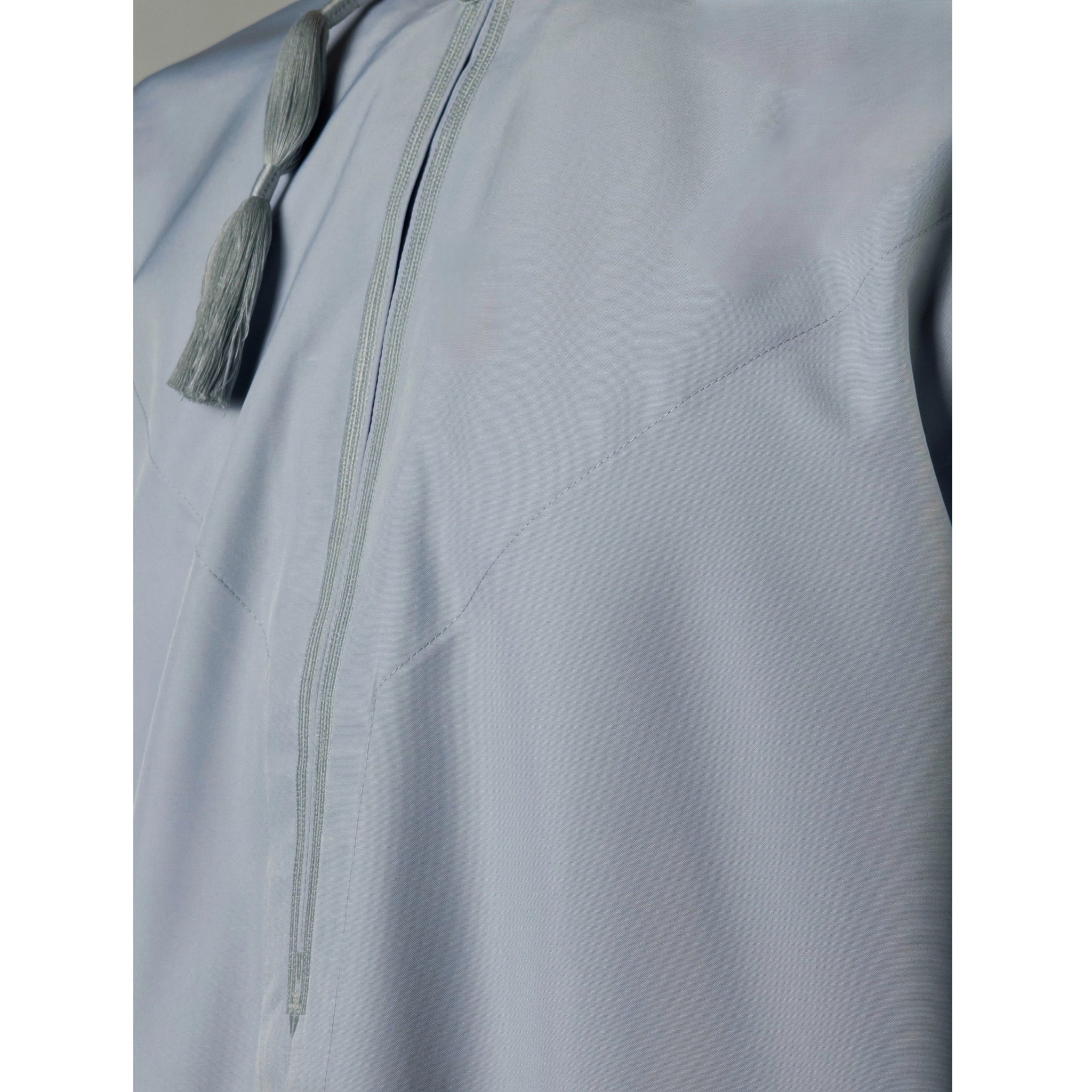 Man's chest wearing Fog Blue Omani Thobe