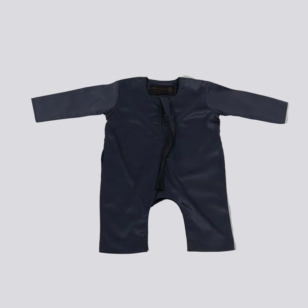 DARK GREY baby romper on a light gray background