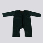 Dark green EMIRATI baby romper on a light gray background