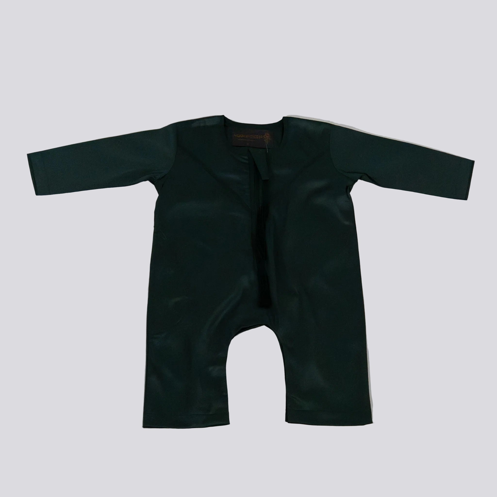 Dark green EMIRATI baby romper on a light gray background