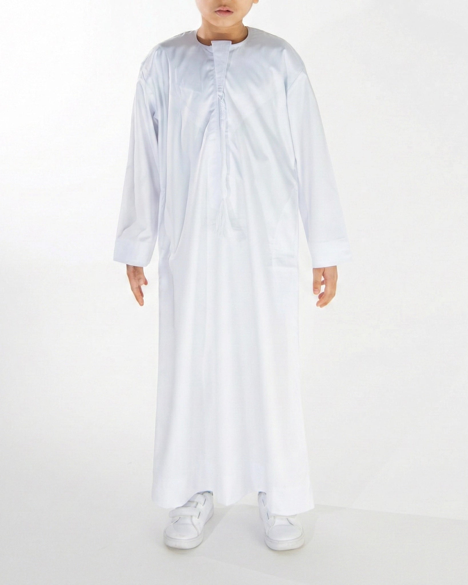 boy wearing a white coloured premium Emirati thobe 